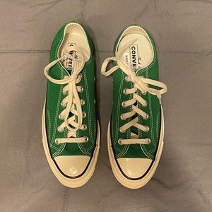 Green Converse, never worn. Size 7.5 women. Off-white trim and laces.